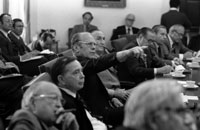 President Ford points to a map of the Cambodian coastal area during a presentation by Secretary of State Henry Kissinger at a briefing on the Mayaguez situation for the Bipartisan Congressional Leadership. 