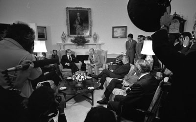 President Ford participates in a ceremony to receive the Report of the Commission on CIA Activities within the United States (Rockefeller Commission) from Vice President Nelson A. Rockefeller and the committee members.   