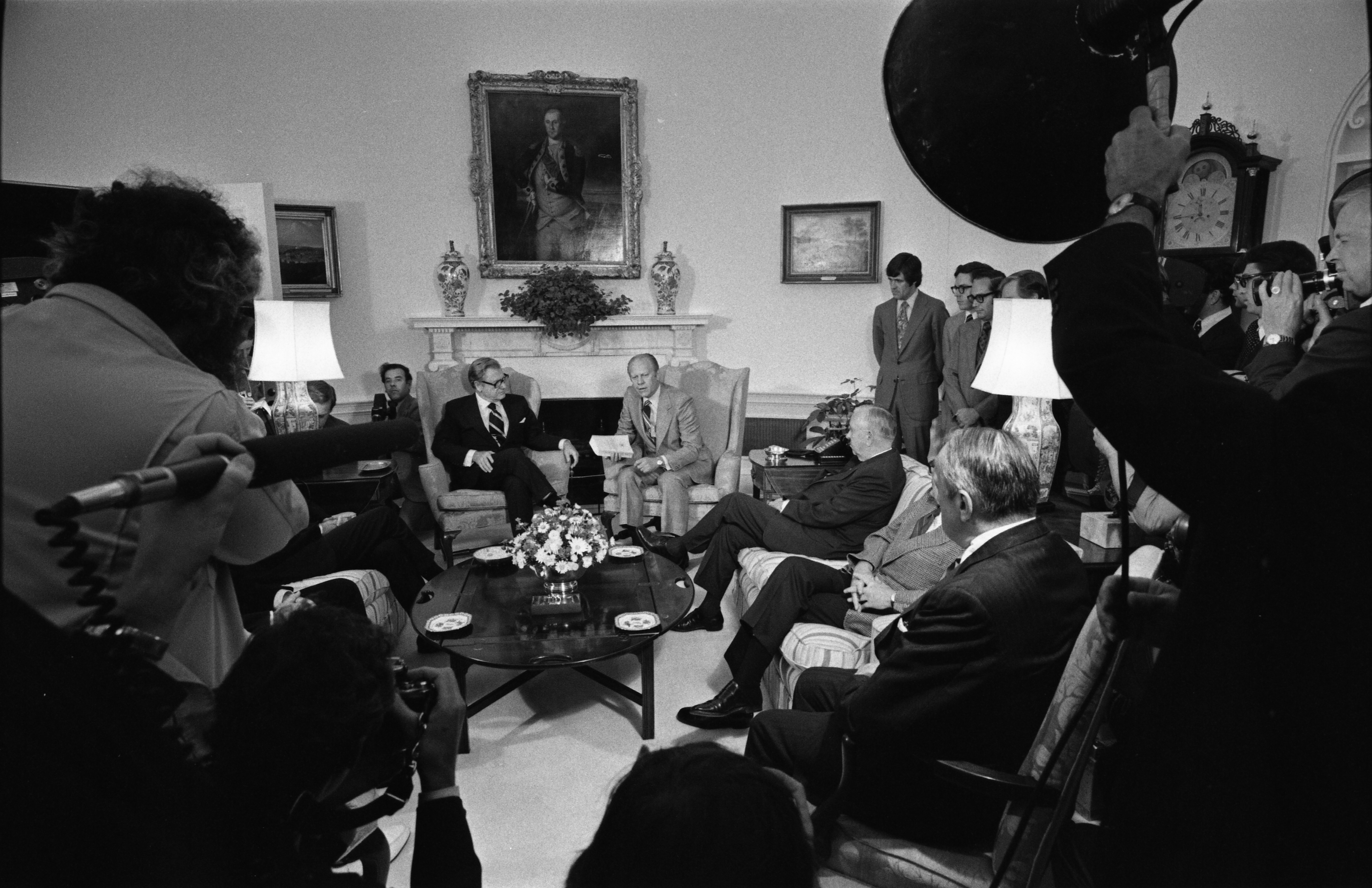 President Ford participates in a ceremony to receive the Report of the Commission on CIA Activities within the United States (Rockefeller Commission) from Vice President Nelson A. Rockefeller and the commssion members.   