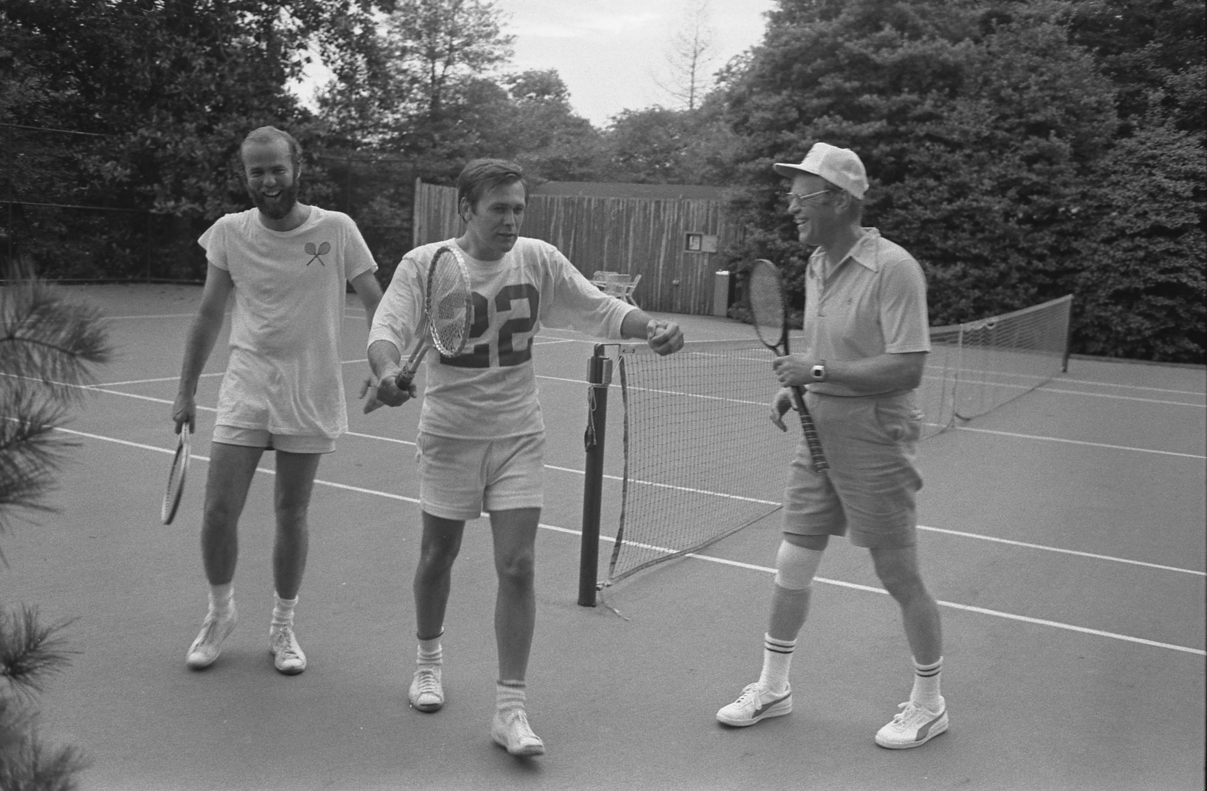 President Ford, Chief of Staff Donald Rumsfeld, and David Kennerly, Personal Photographer to the President, following a tennis match on the White House Tennis Courts.  (not shown Deputy Press Secretary Bill Greener, Jr.) 