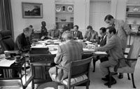 President Ford and staff review a draft of his address to the Nation on recommendations for tax reduction and spending, to be delivered that evening. 