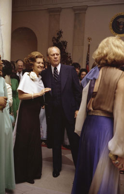 President and First Lady Betty Ford pause on the dance floor at a White House state dinner in honor of Egyptian President and Mrs. Anwar Sadat.   
