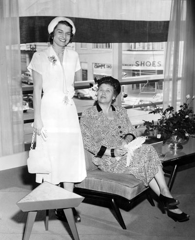 Betty Ford and her mother-in-law, Mrs. Gerald R. Ford, Sr., pose for a photo while attending a luncheon at Herpolsheimers’ department store in Grand Rapids, where Mrs. Ford had previously worked as a fashion coordinator.  