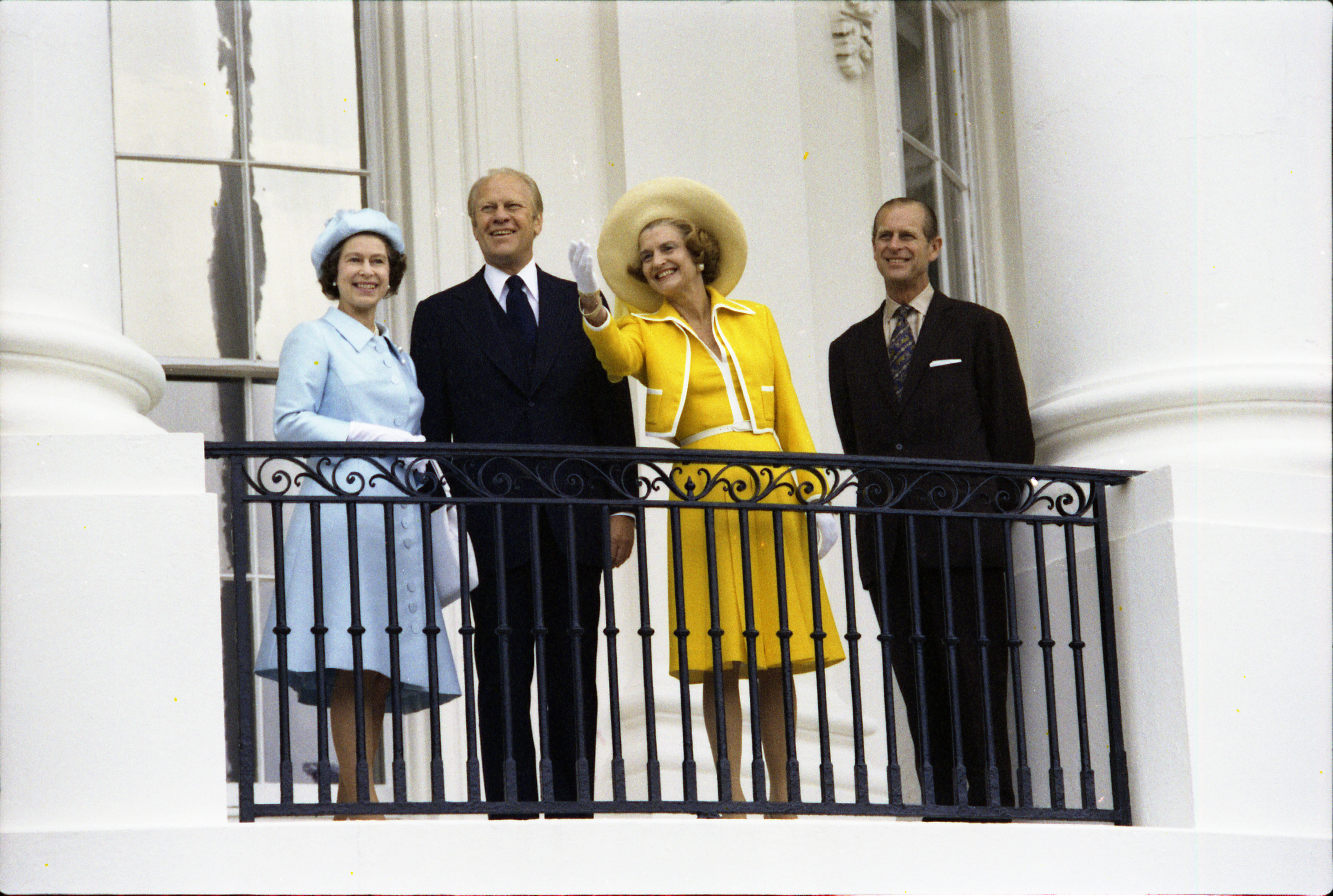 President and Mrs. Ford and Her Majesty Queen Elizabeth II and Prince Philip on the Truman Balcony following the Queen's state arrival at the White House.  