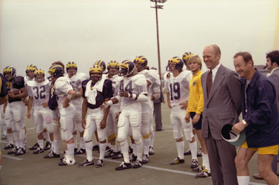 President Ford and coach Bo Schembechler watch the University of Michigan football team practice. 