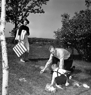 Betty Ford joins husband Gerald and son Michael for some play in the yard outside their apartment. 