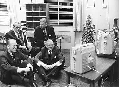 Representative Gerald R. Ford, Senator Everett M. Dirksen, Ray Bliss and Thruston Morton watch election returns on several televisions in an unidentified office. November 8, 1966.