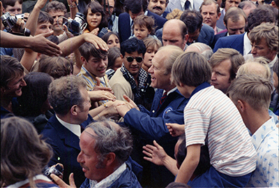 President Ford greeting the crowd during a picnic with American and Federal Republic of Germany military personnel and their families at Ayres Kaserne, Kirchgoens, West Germany.