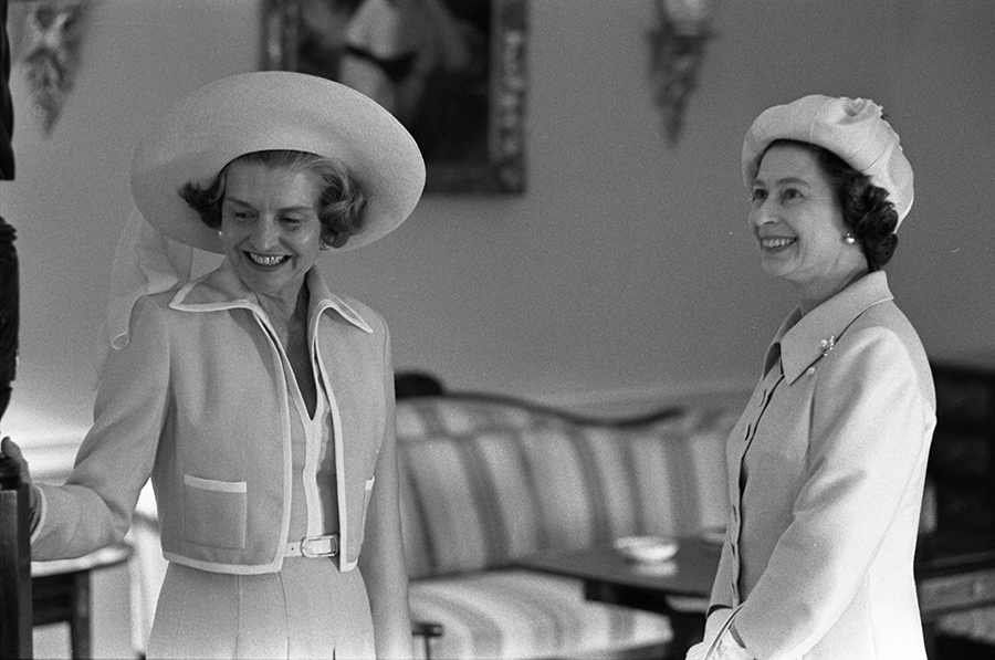 First Lady Betty Ford and Queen Elizabeth II view the Queen's Bedroom during a tour of the White House.