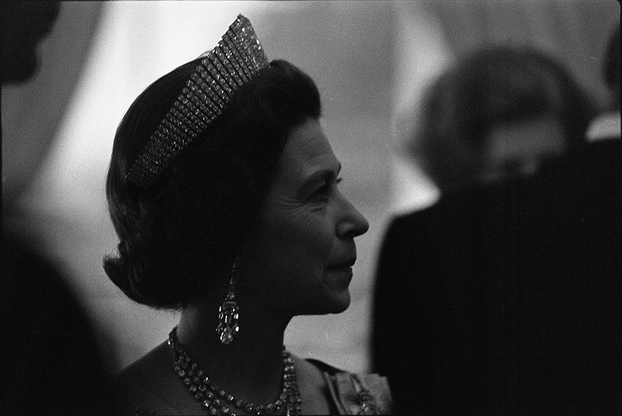 Queen Elizabeth II attending a reception in the Yellow Oval Room prior to a state dinner held in her honor.