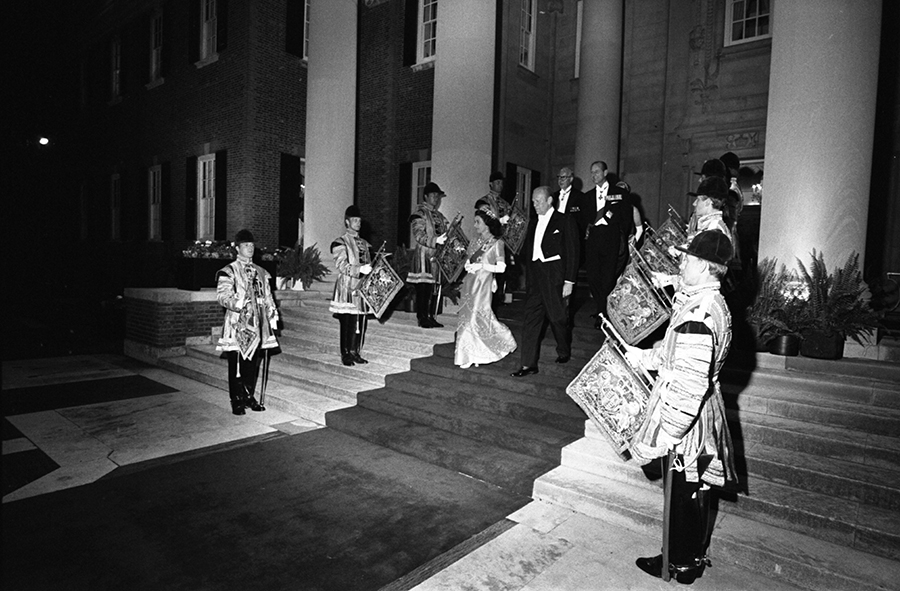 Queen Elizabeth II, President Ford, Prince Philip, and others entering the garden at the British Embassy in Washington, DC for a reciprocal state dinner hosted by the Queen.