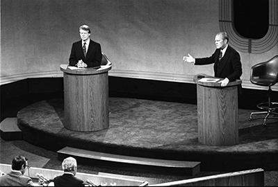 President Ford and Jimmy Carter meet at the Walnut Street Theater in Philadelphia to debate domestic policy during the first of three Ford-Carter Debates.