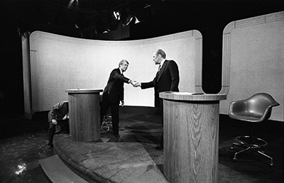 President Ford and Jimmy Carter shake hands during the last of the three Ford-Carter Debates held at the College of William and Mary in Williamsburg, Virginia.