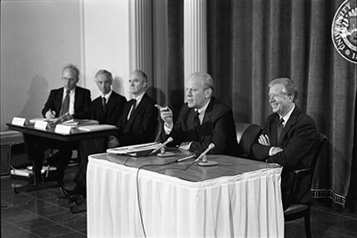 Former Presidents Jimmy Carter and Gerald R. Ford participate in a panel discussion at the Symposium on New Weapons Technologies and Soviet-American Relations at the University of Michigan in Ann Arbor, Michigan.