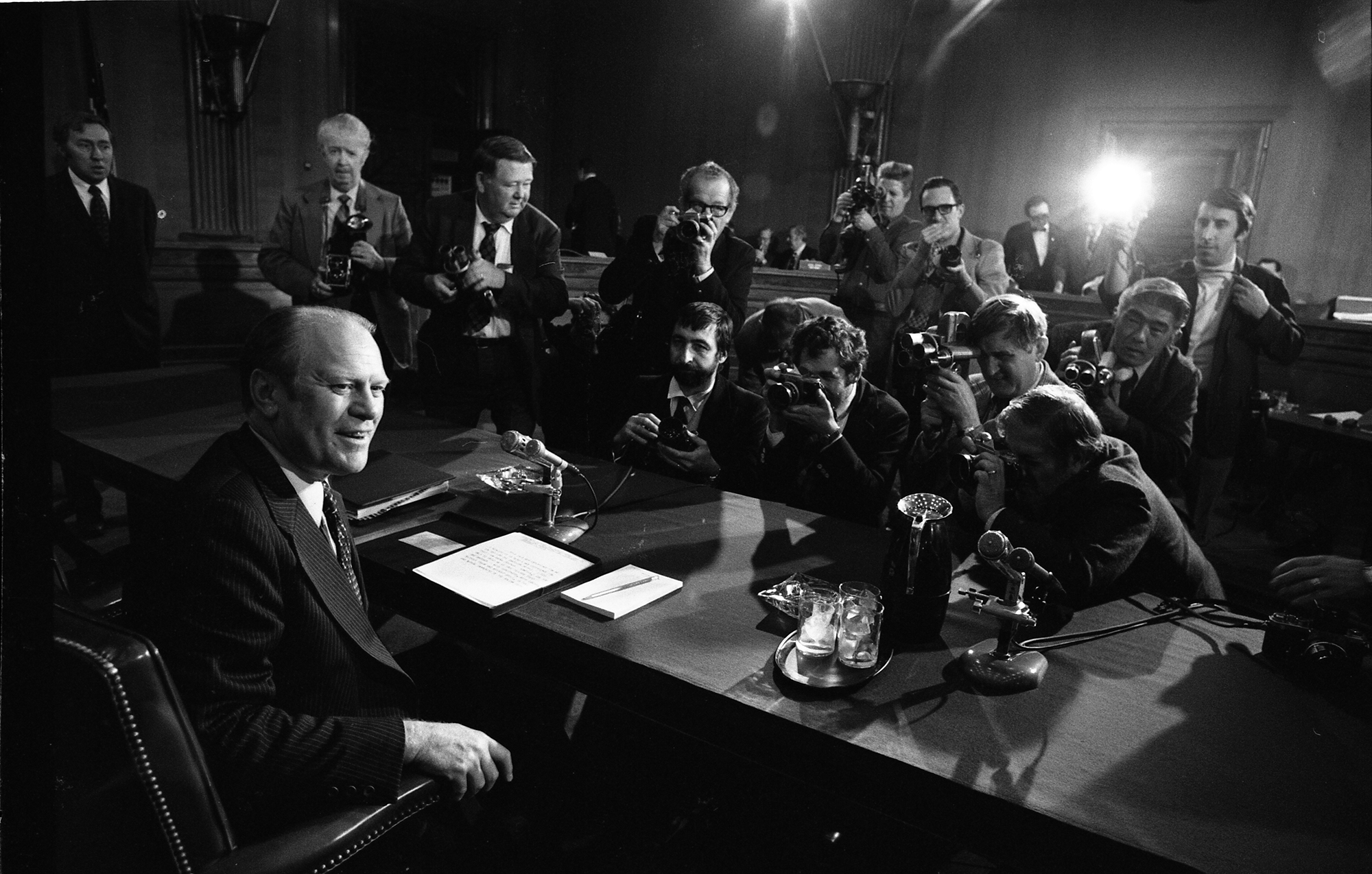 Gerald Ford and members of the press at his Vice Presidential confirmation hearing.