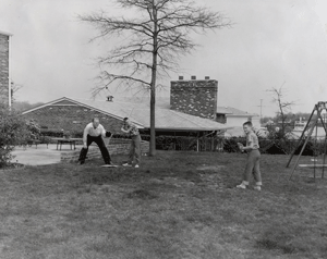 Gerald Ford plays baseball with sons Jack and Mike in the back yard of their Alexandria, Virginia home in 1961. 