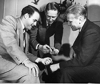 Gerald R. Ford talks baseball with St. Louis Cardinals Red Schoendienst and Joe Garagiola in Peoria, Illinois on January 21, 1950.