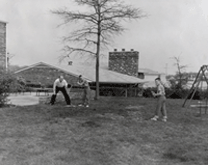 Gerald Ford plays baseball with sons Jack and Mike in the back yard of their Alexandria, Virginia home in 1961.