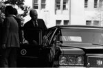 President Ford enters the limousine upon on his departure from Constitution Hall after he addressed the 63rd Annual Meeting of the U.S. Chamber of Commerce.