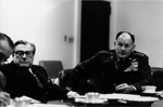 A4238-15A. Vice President Nelson A. Rockefeller and General George S. Brown, Chairman of the Joint Chiefs of Staff, attend an evening meeting of the National Security Council to discuss the evacuation of Saigon. April 28, 1975