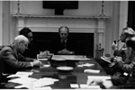 A4238-4A. President Ford presides over an evening meeting of the National Security Council to discuss the evacuation of Saigon. April 28, 1975. (clockwise, l-r: Robert S. Ingersoll, Deputy Secretary of State; Henry Kissinger; President Ford; James Schlesinger, Defense Secretary; and General George S. Brown, Chairman of the Joint Chiefs of Staff. Not shown: William Colby, Director, CIA; William Clements, Deputy Secretary of Defense; and Vice President Nelson Rockefeller.) 