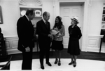 A4253-19. In the Oval Office President Ford greets Miss Lisa Lyon, Miss National Teenager of 1974-75; Rep. Richard Kelly of Florida's 5th Congressional District; and Mrs. E. G. Schaeffer, Director of the Miss National Teenager Pageant. April 28, 1975.