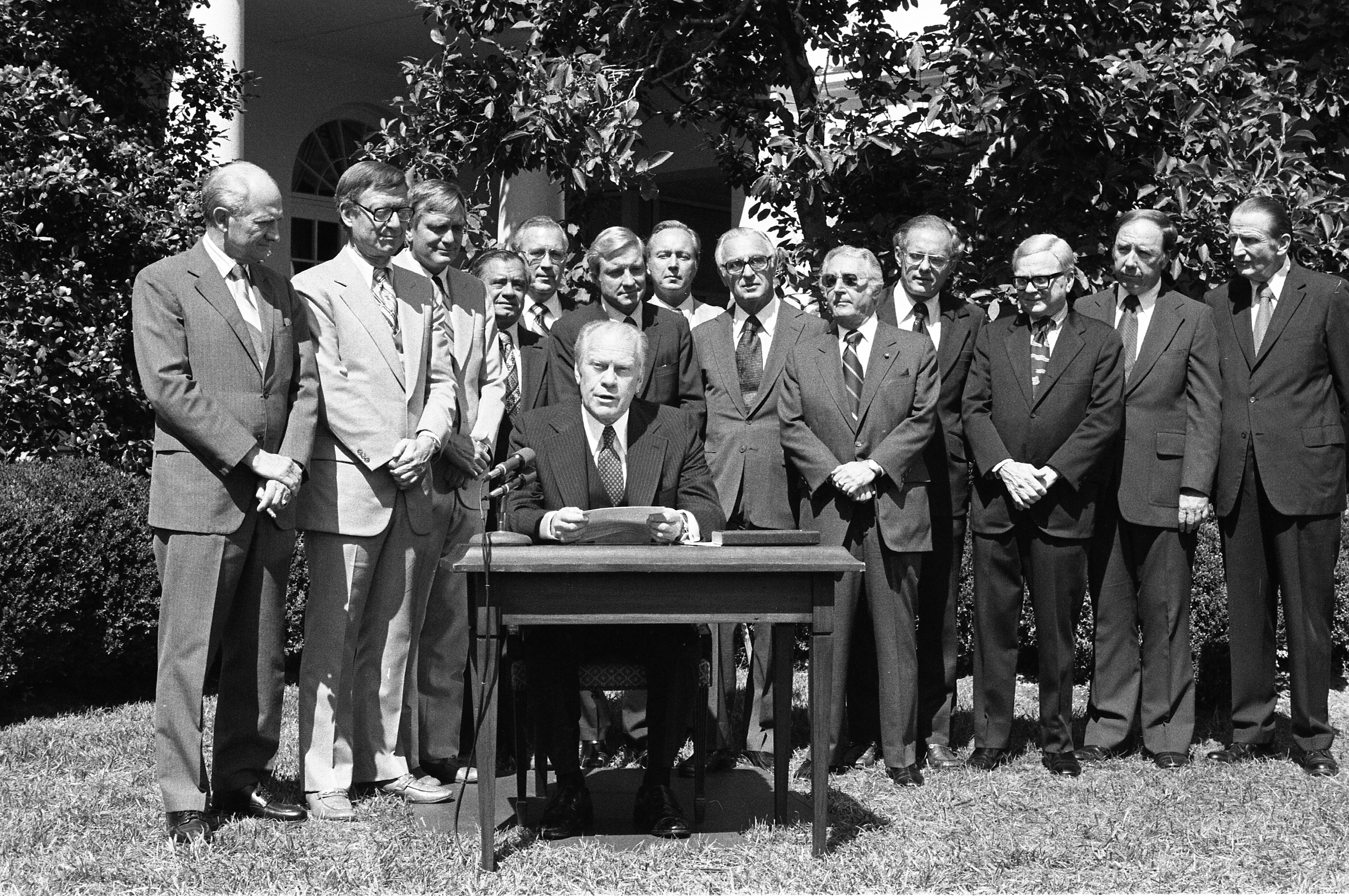 President Gerald Ford and several members of Congress at the signing ceremony for the Government in the Sunshine Act, 9/13/1976
