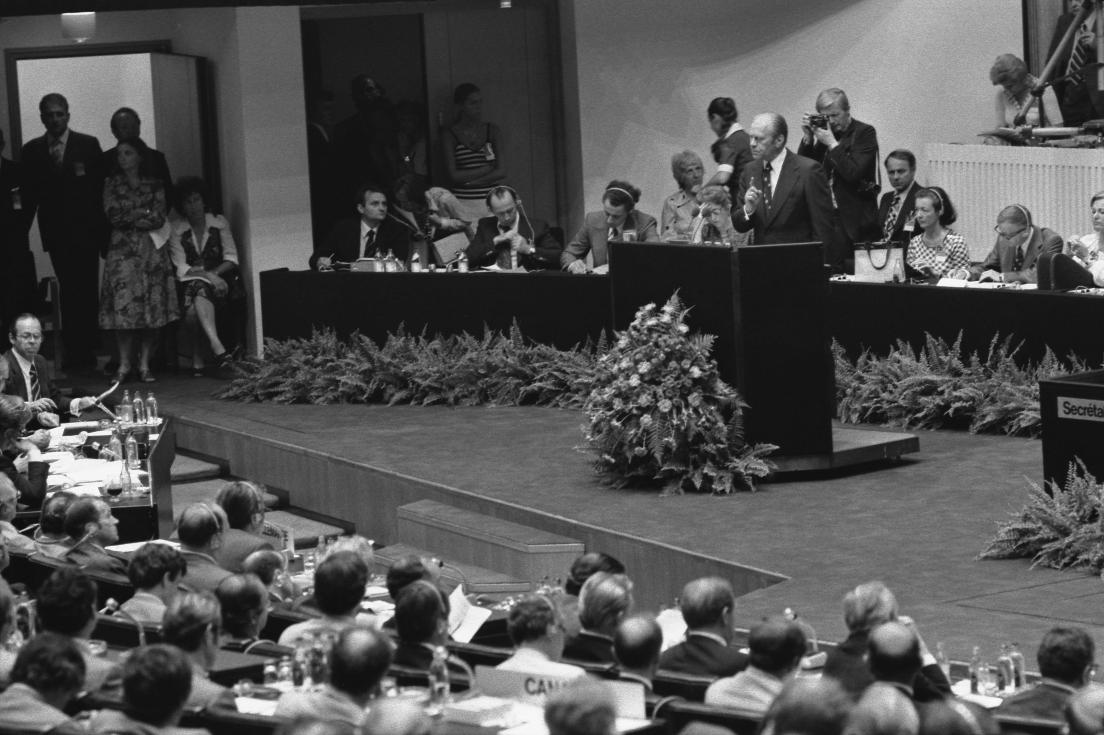 President Ford Addressing Del../egates during the Plenary Session of the Conference on Security and Cooperation in Europe (CSCE) in Finlandia Hall in Helsinki, Finland, 8/1/1975