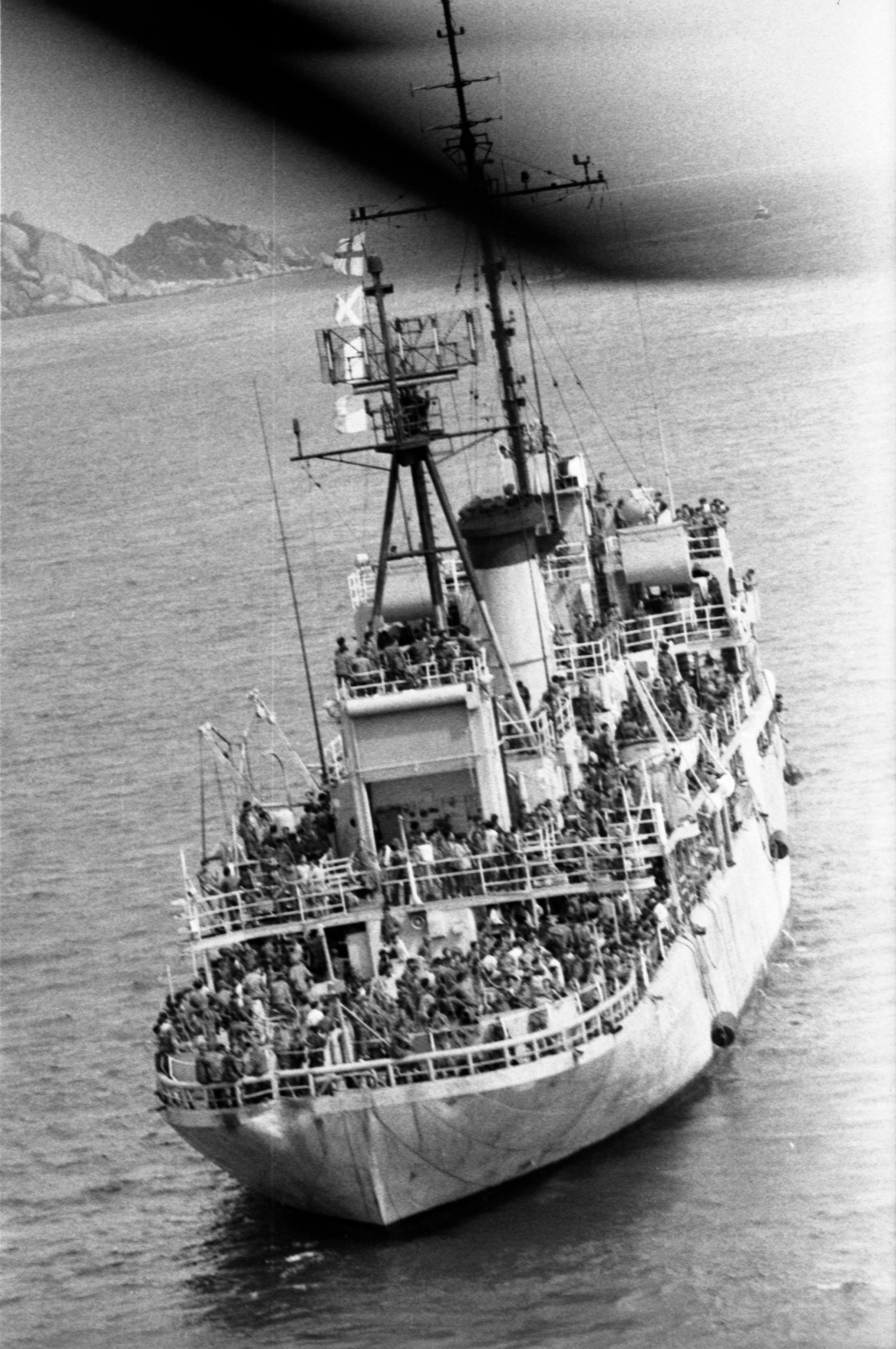 Vietnamese leaving Da Nang crowd onto a ship bound for Cam Ranh Bay, South Vietnam. March 30, 1975.