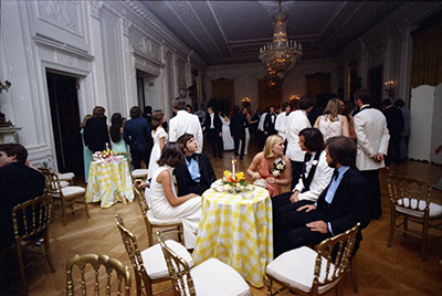 Susan Ford sitting with classmates and their dates during the Holton-Arms Senior Prom, 5/31/1975