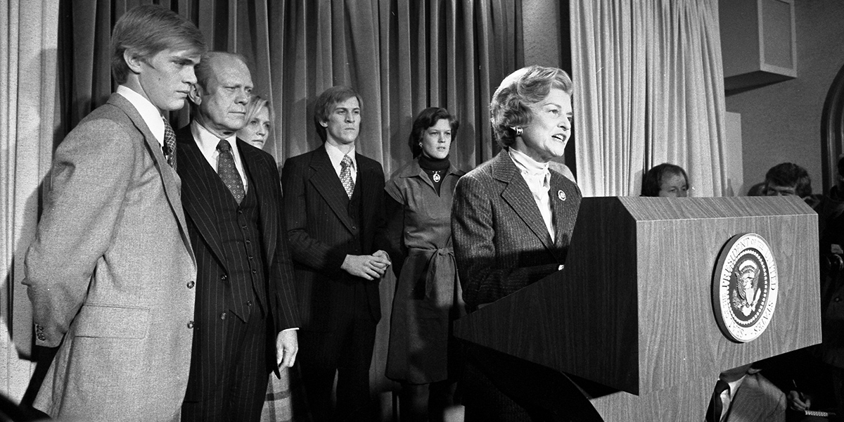 Betty Ford at the podium with the Ford family behind her during the concession speech.