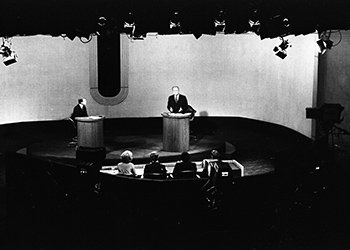 A photo that captures a moment on the stage during the debate