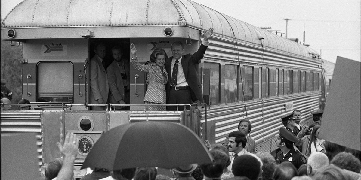 President and Betty Ford waiving from the train during his Whistle Stop tour in Michigan.