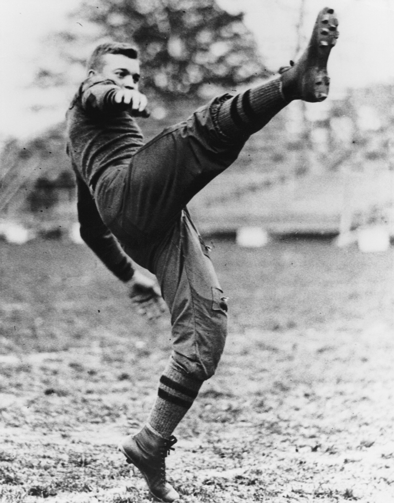 Eisenhower kicking football