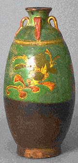 Porcelain celadon jar with molded peony scroll design