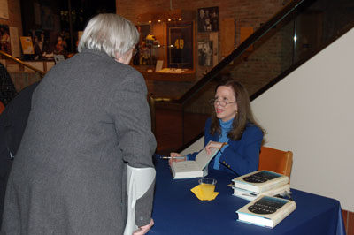Forming a long line after the talk, new book owners chatted with Mrs. Wright and obtained an autograph.