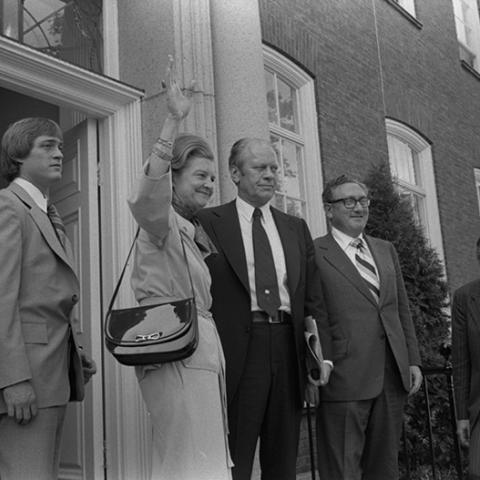 Gerald R. Ford, Betty Ford, Jack Ford, Kissinger standing outside the American Embassy Residence