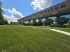 The expansive front lawn of the Museum is shown