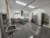 Catering kitchen with large sink and metal tables
