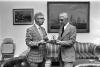 Lewie H. Miller, Jr. Presenting the Aitken Bible Silver Ingot to Milton Mitler