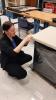 Intern is adjusting the protective wrap on a case