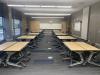 Pods of wooden desks are shown