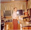 H0072-9. Gerald R. Ford tackles the clean up chores in the kitchen of the family residence at 514 Crown View Drive, Alexandria, VA. 1972. H0072-9. Gerald R. Ford tackles the clean up chores in the kitchen of the family residence at 514 Crown View Drive, Alexandria, VA. 1972.
