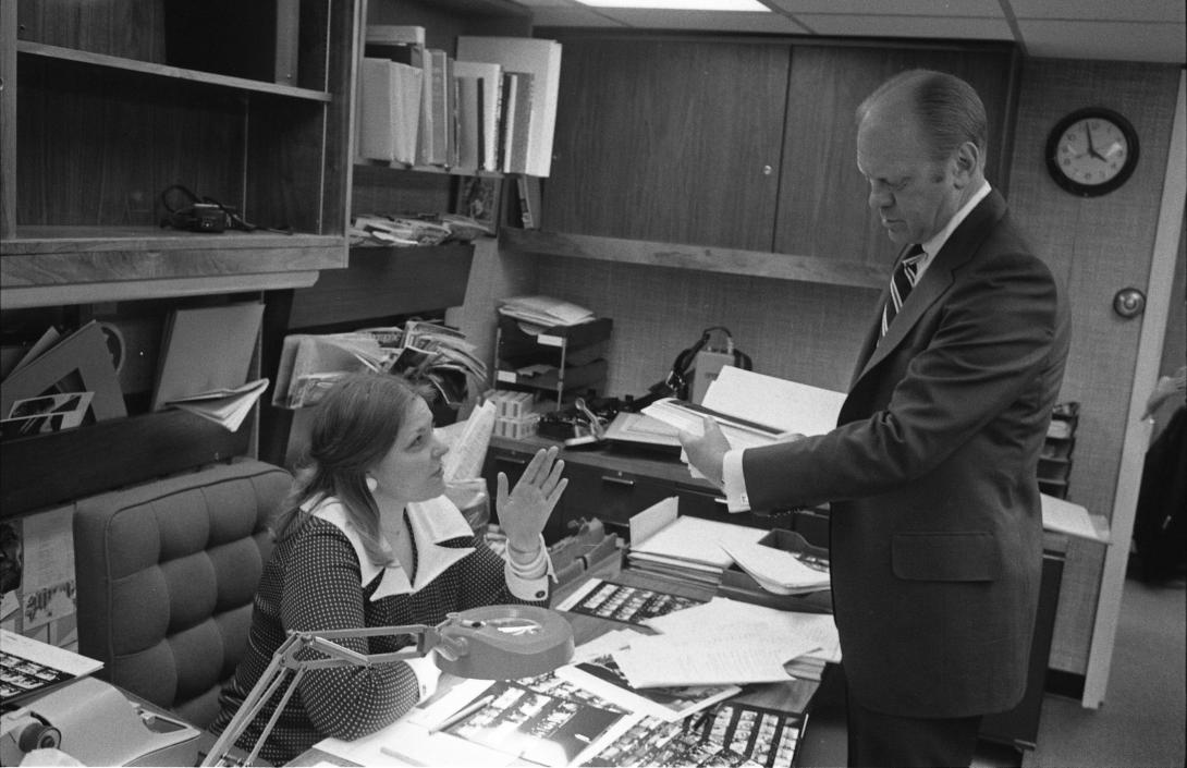 President Gerald R. Ford Looking at Photographs with Photo Editor Sandra Eisert in the White House Photographic Office