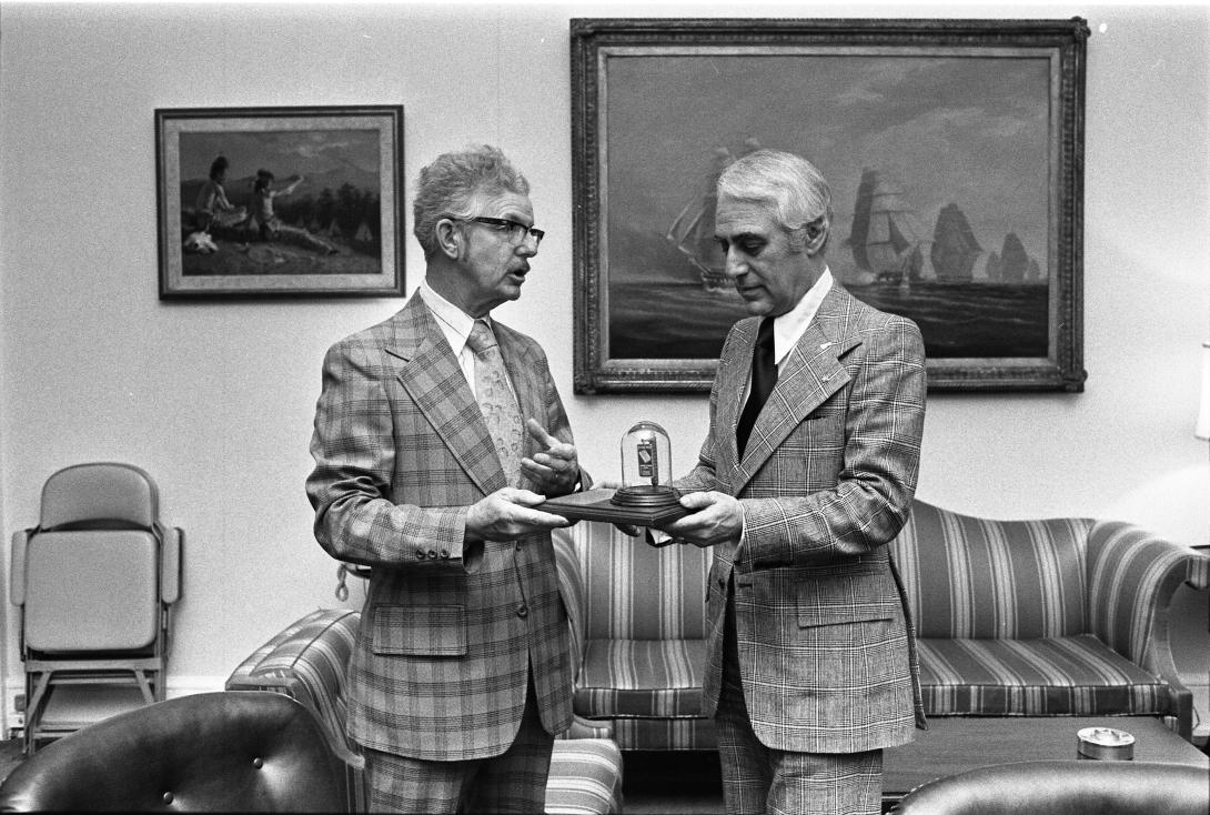 Lewie H. Miller, Jr. Presenting the Aitken Bible Silver Ingot to Milton Mitler