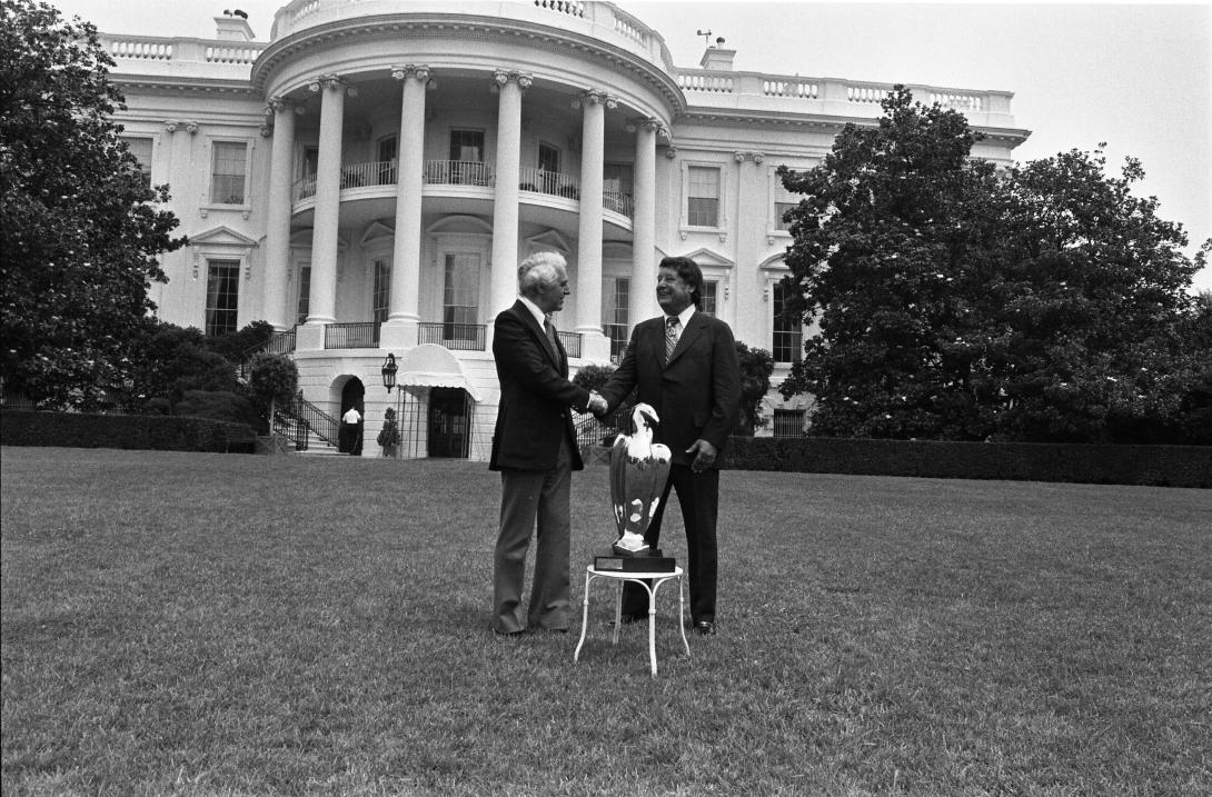 Sculptor Manuel Carbonell Presenting His Sculpture, Bicentennial Eagle, to Milt Mitler on the South Lawn of the White House