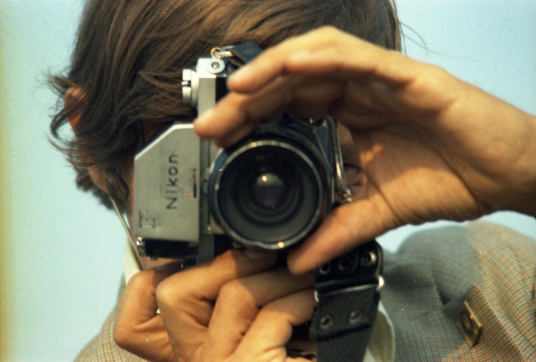 White House photographer Karl Schumacher takes photographs during a presidential trip to Mackinac Island, Michigan, on July 12, 1975.