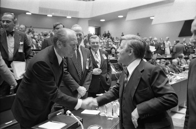 Gerald R. Ford and Helmut Schmidt shaking hands at Finlandia Hall, Helsinki, Finland