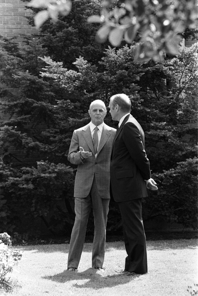 Gerald R. Ford and Constantine Caramanlis stand and talk