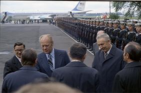 Gerald R. Ford and Gierek shake hands with others at the Okecie Airport in Warsaw, Poland.